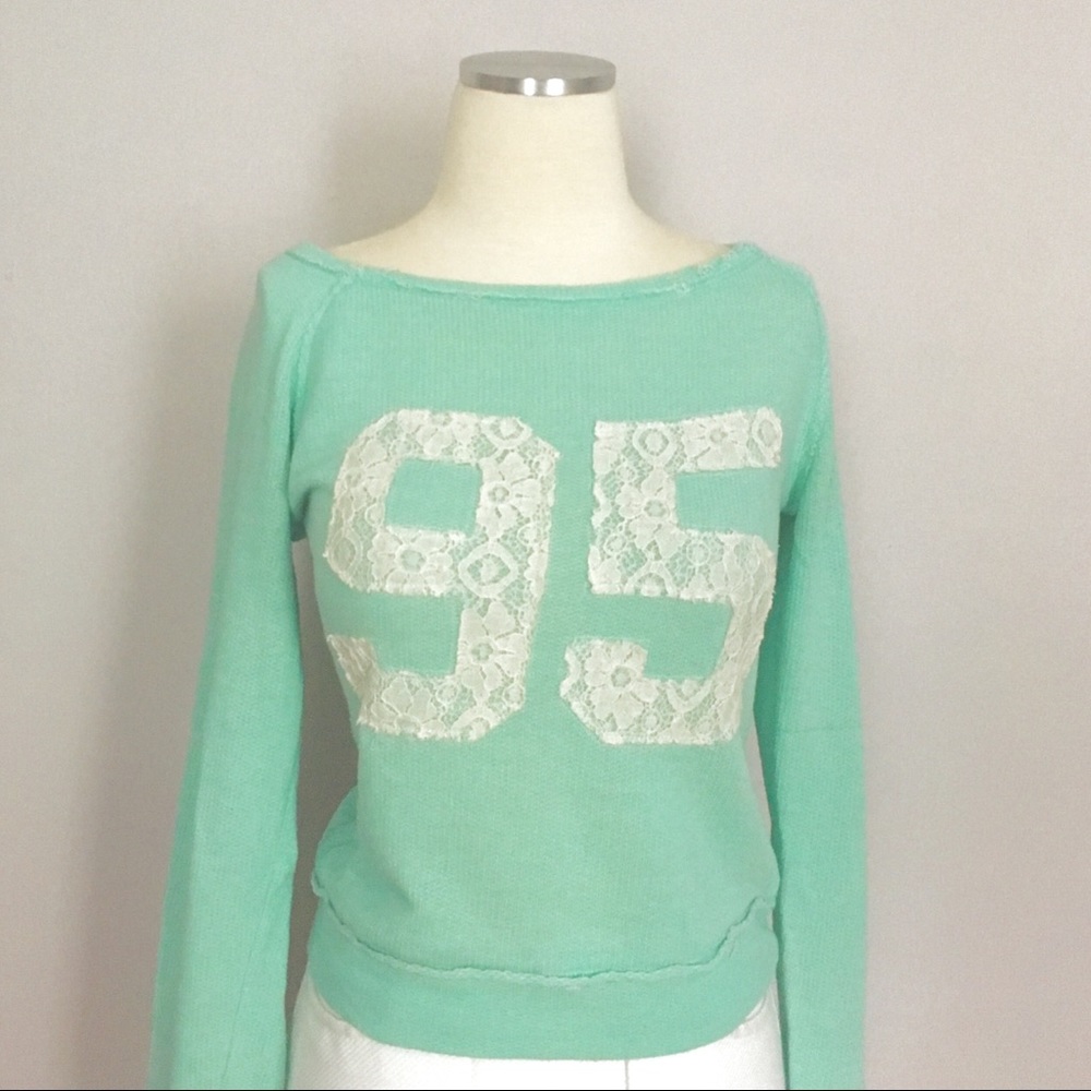 Sea-foam green appliqué distressed LS juniors top